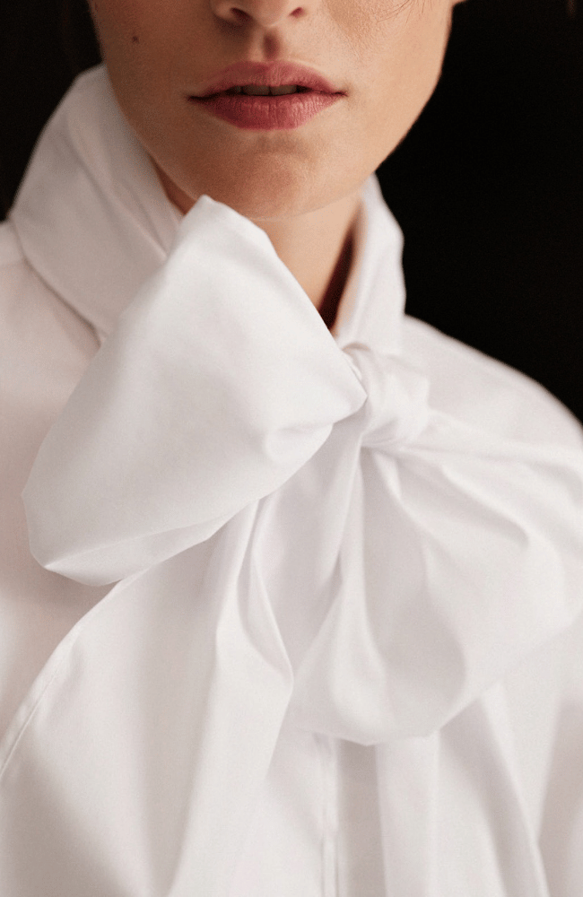 NEW VOYAGE BOW BLOUSE in WHITE-EMANOU-FLOW BY NICOLE CANADA