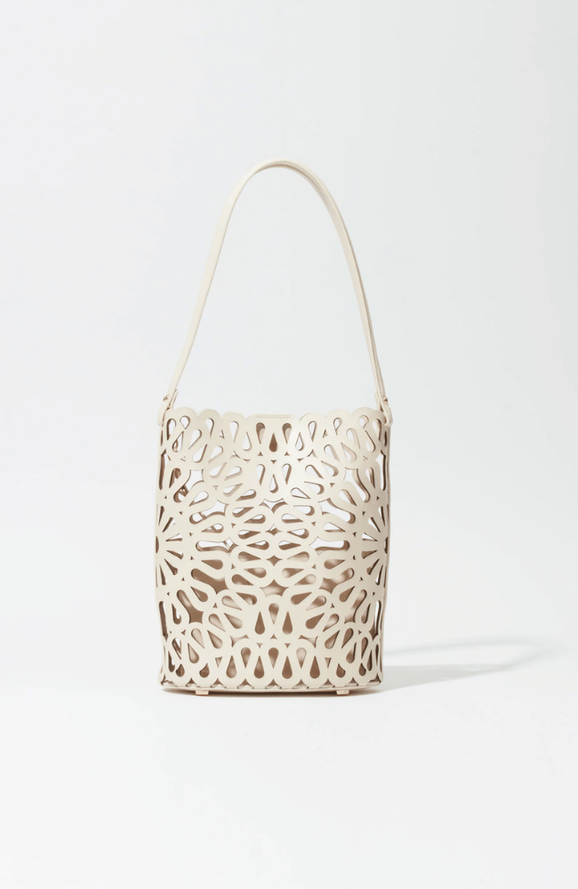 MCCALL LASER CUT LEATHER BUCKET BAG in CREAM-SIMKHAI-FLOW BY NICOLE CANADA