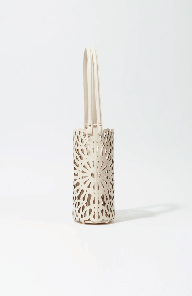 MCCALL LASER CUT LEATHER BUCKET BAG in CREAM-SIMKHAI-FLOW BY NICOLE CANADA
